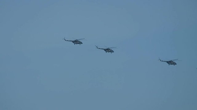 Military Russian helicopters in the sky. Alligator reconnaissance and attack helicopter of a new generation. 