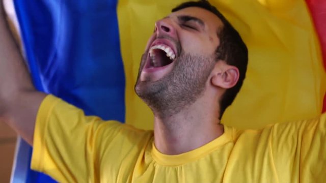 Romanian fan celebrating with flag