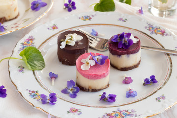 Raw vegan desserts with fresh violet flowers