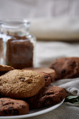 Open jar of instant coffee arranged on woden table, top view, close-up, selective focus.