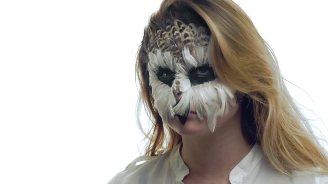Close-up, Beautiful Girl with the Bird's Grim Bends the Head Like the Sove