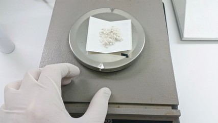 Weighing a chemical in the chemistry lab