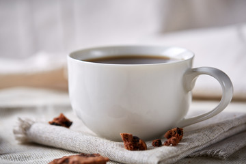 Breakfast background with mug of fresh coffee, homemade oatmeal cookies, grind coffee