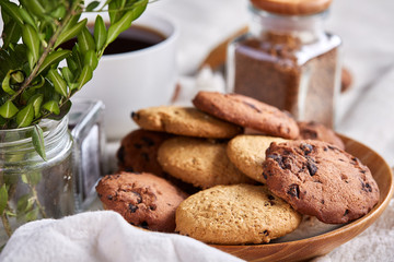 Open jar of instant coffee arranged on woden table, top view, close-up, selective focus.