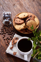 Breakfast background with mug of fresh coffee, homemade oatmeal cookies, grind coffee