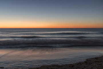 Fototapeta na wymiar The beach at sunrise