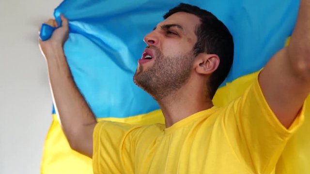 Ukraine fan celebrating with flag