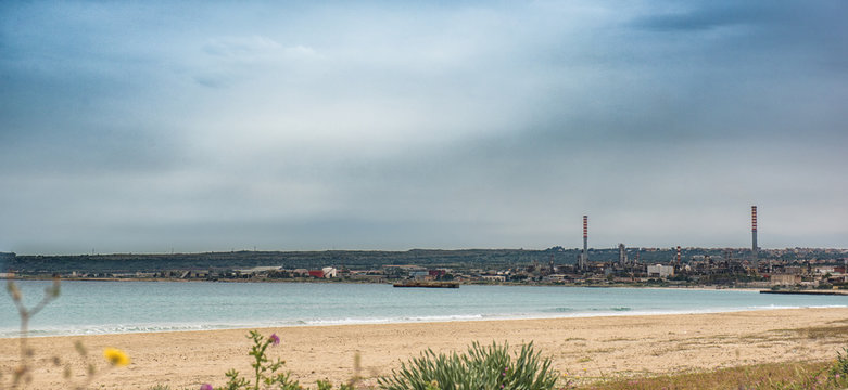 Industrial landscape on sea in Sicily Piolo