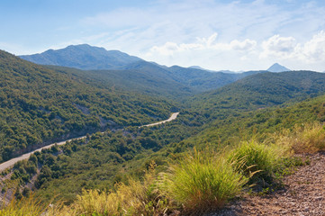 Fototapeta na wymiar Summer mountain landscape with road. Dinaric Alps, Montenegro
