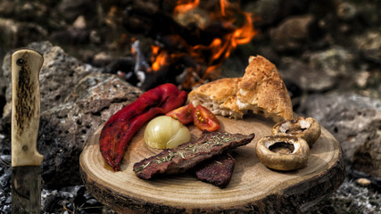 grilled meat on camping food on wooden service