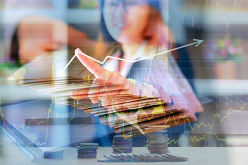 Double exposure of Business Asian  woman pointing at something on screen . investment financial concept .