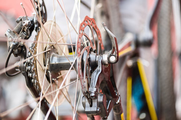 Mountain bicycle repairing. MTB rear wheel disk brakes closeup