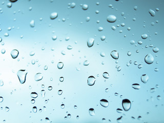 rain droplets on the glass and blue background