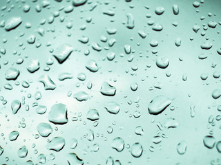 rain droplets on the glass and blue background