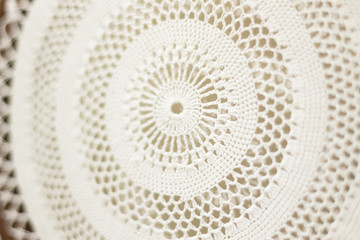 Texture of crocheted napkin. Selective focus, defocus