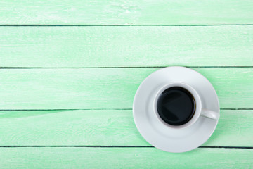 Blank business cards, white cup on the wooden table. Template for ID. Top view.
