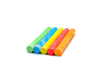 chalks in a variety of colours arranged on a white background