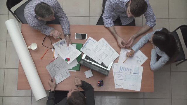 young business team working in office top view