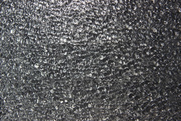 Background, texture, bubbles - grey abstract pattern on glass