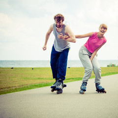 roller skater couple skating outdoor