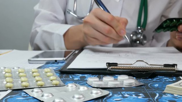 woman doctor write prescription