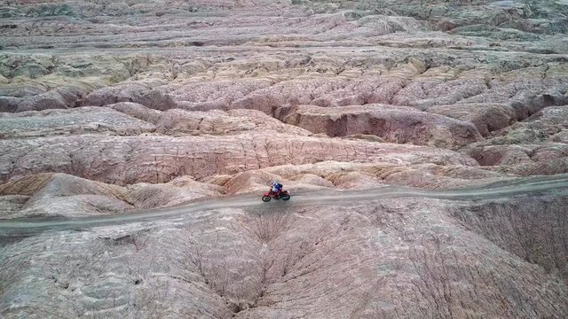 Motorcycle Dirt Bike Rider Riding Narrow Trail in the Desert