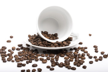 Coffee beans in coffee cup isolated on white