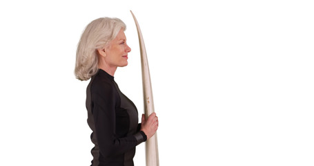 Portrait of old surfer lady standing with her surfboard on white copy space