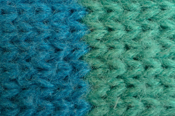 Textile texture of wool. Green, white, blue.