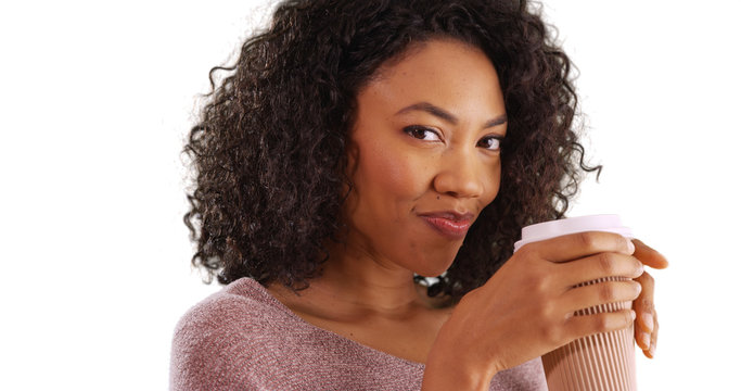 Spunky Black Woman Enjoying Coffee And Looking At Camera On White Background