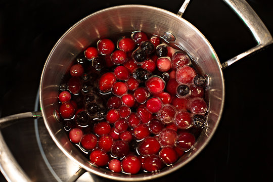 Compote with berries in a saucepan on the stove