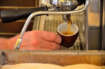Barista prepares an espresso cup