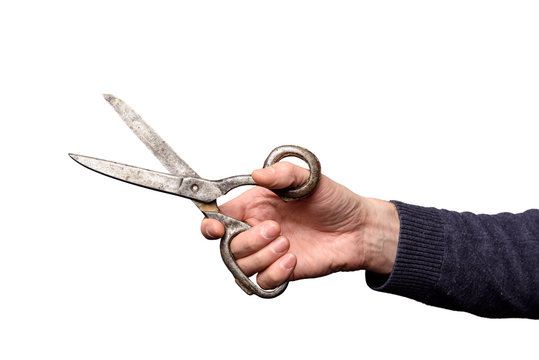 Huge scissors open in male hand