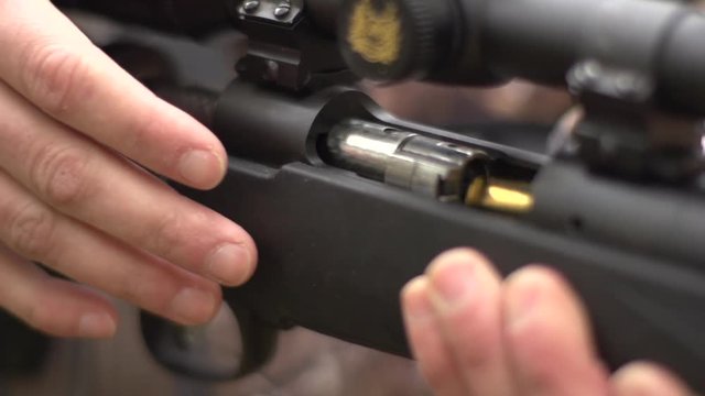high speed shots of closing a bolt action rifle