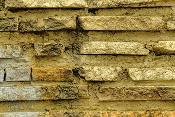 Grunge Autumn maple brick wall texture, background of stone, rock surface