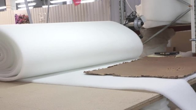 man cuts paralon making furniture