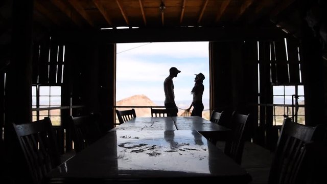 Silhouettes of a couple standing in a doorway