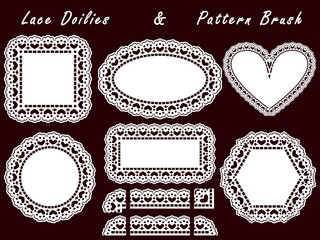 Pattern lace brush and openwork white napkin isolated on a dark background.