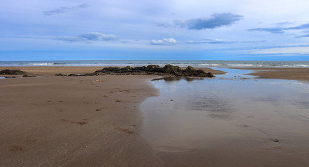 Fototapeta na wymiar Panoramic view of St Cyrus beach. Aberdeenshire, Scotland, UK.