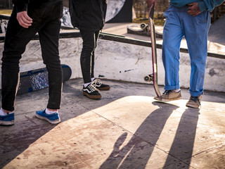 close up friends in skate park on a summer day