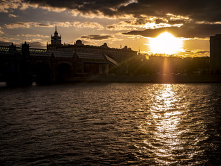 Fototapeta premium old architecture near the river sunset in urban city silhouette