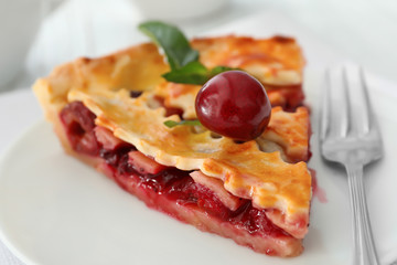 Delicious piece of cherry pie on plate