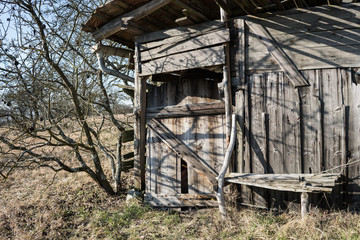 a wooden hut in the countryside