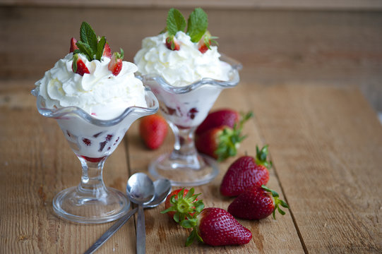 softijs with strawberries, kiwi and cream. ice-cream with fruits in a cube