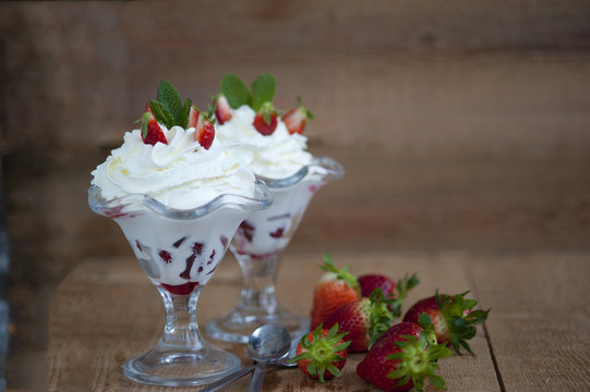 softijs with strawberries, kiwi and cream. ice-cream with fruits in a cube