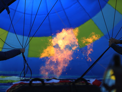 The fire rising the inside of a hot air balloon.