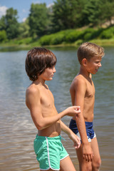 background. friends came to the river to swim