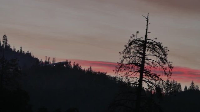 Epic Slow Motion Large Air Tanker Aircraft Drops Retardant on Forest Fire at Sunset