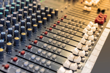 Sound technician audio mixer equalizer control for background.