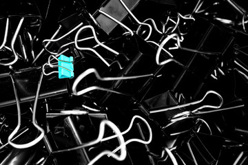 A color binder clip ,multi binder paper clip backgtound in black and white style.